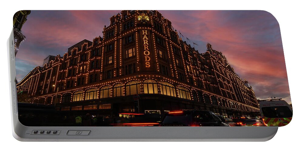 Christmas Portable Battery Charger featuring the photograph Harrods at sunset by Andrew Lalchan