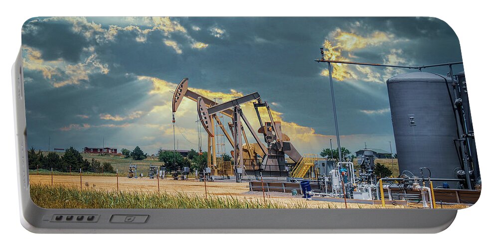 Tanks Portable Battery Charger featuring the photograph Harvesting Oil by Susan Vineyard