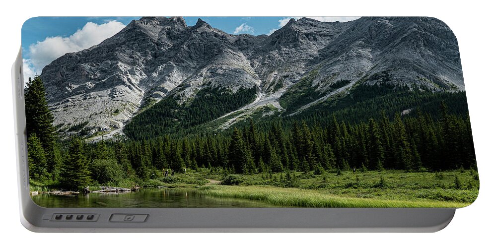 River Portable Battery Charger featuring the photograph headwaters of the Elbow River by Karen Rispin