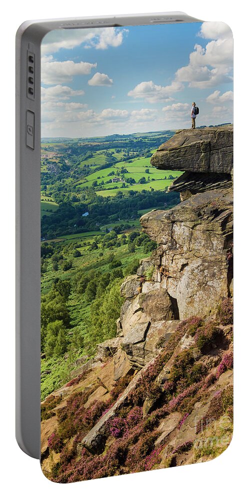 Derbyshire Portable Battery Charger featuring the photograph Hiker standing alone on Froggatt Edge, Derbyshire Peak District National Park, England by Neale And Judith Clark