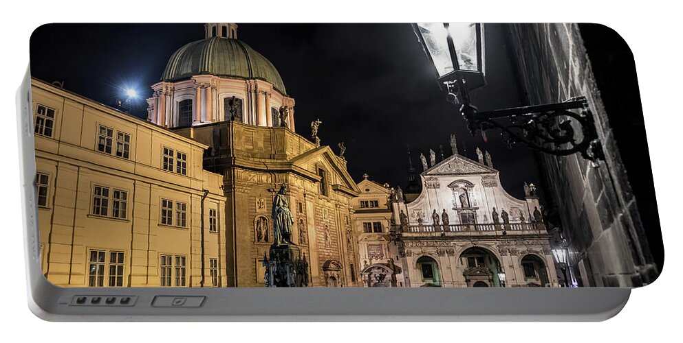 Ancient Portable Battery Charger featuring the photograph Historic Buildings Beneath The Tower Of Charles Bridge In The Night In Prague In The Czech Republic by Andreas Berthold