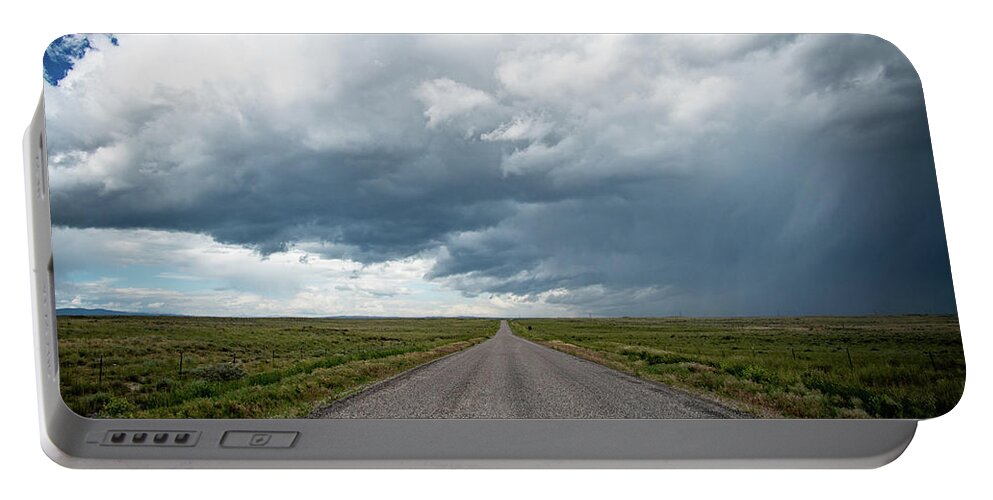 Storm Portable Battery Charger featuring the photograph Idaho Stormy Road by Wesley Aston
