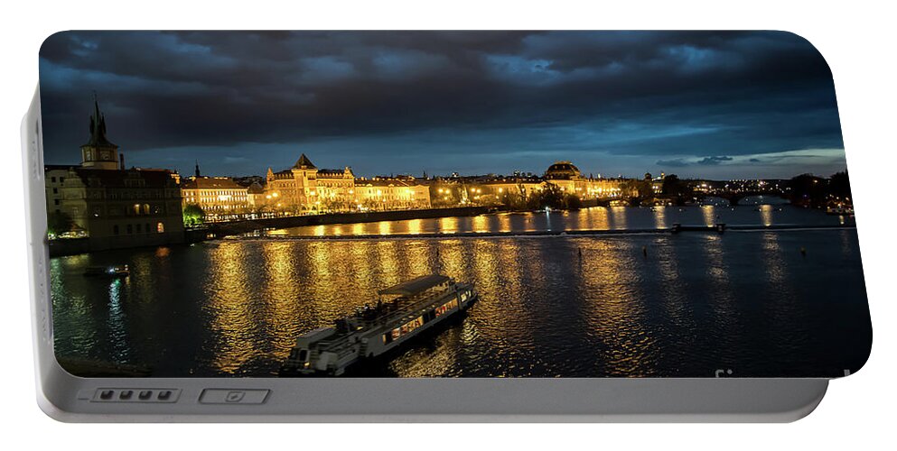 Architecture Portable Battery Charger featuring the photograph Illuminated Moldova River With Ship And Buildings In The Night In Prague In The Czech Republic by Andreas Berthold