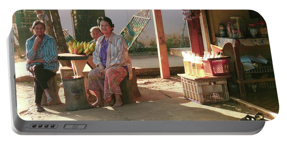Issan Portable Battery Charger featuring the photograph In a Thai village by Jeremy Holton