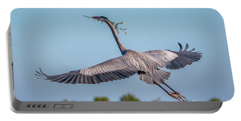 Heron Portable Battery Charger featuring the photograph Incoming Flowers by Tom Claud
