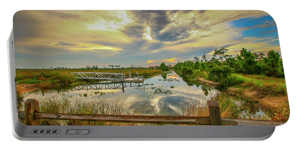 Sun Portable Battery Charger featuring the photograph Kayak Launch Sunset by Tom Claud