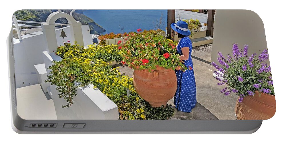 Santorini Portable Battery Charger featuring the photograph Lady in blue in Santorini by Yvonne Jasinski