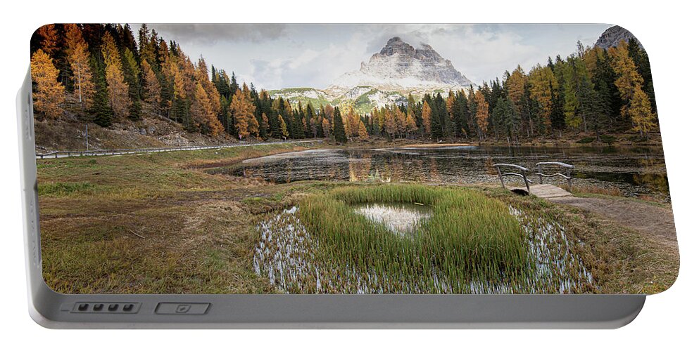 Lago Di Antorno Portable Battery Charger featuring the photograph Lago di antorno lake and Tre cime di lavadero mountain reflection in autumn. Forest landscape South tyrol Italy by Michalakis Ppalis