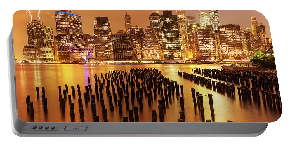 Lightning Storm Portable Battery Charger featuring the photograph Lightening Strikes over New York Skyline by Neale And Judith Clark