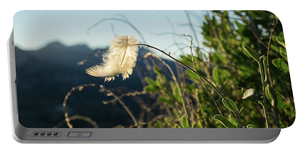 Feather Portable Battery Charger featuring the photograph Light feather in the wind by Adriana Mueller