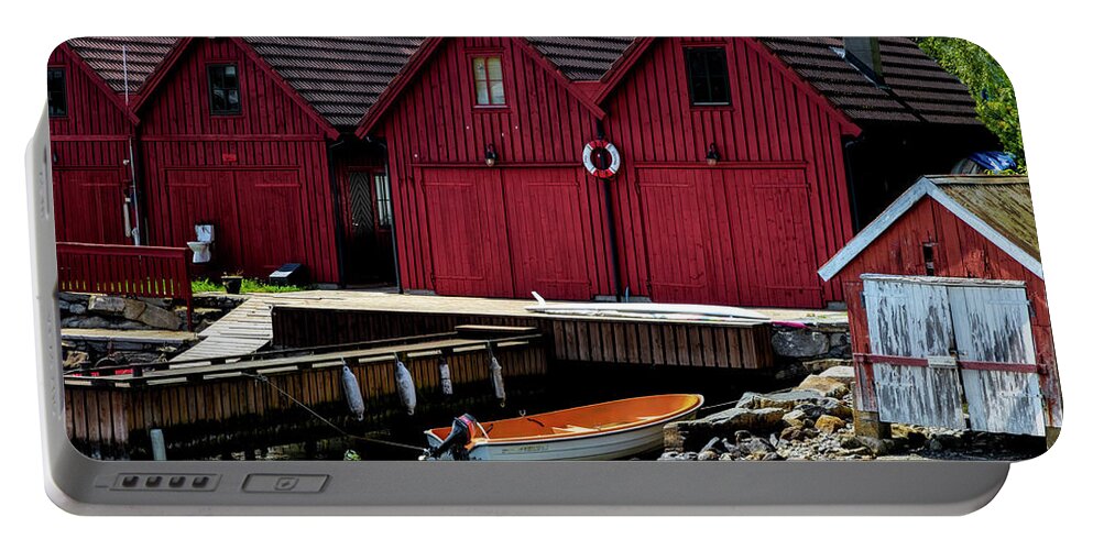 Barns Portable Battery Charger featuring the photograph Little Red Fishing Huts by Debra and Dave Vanderlaan