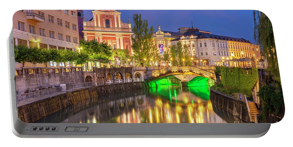 Ljubljana Slovenia Portable Battery Charger featuring the photograph Ljubljanica river and the triple bridge at night, Slovenia by Neale And Judith Clark