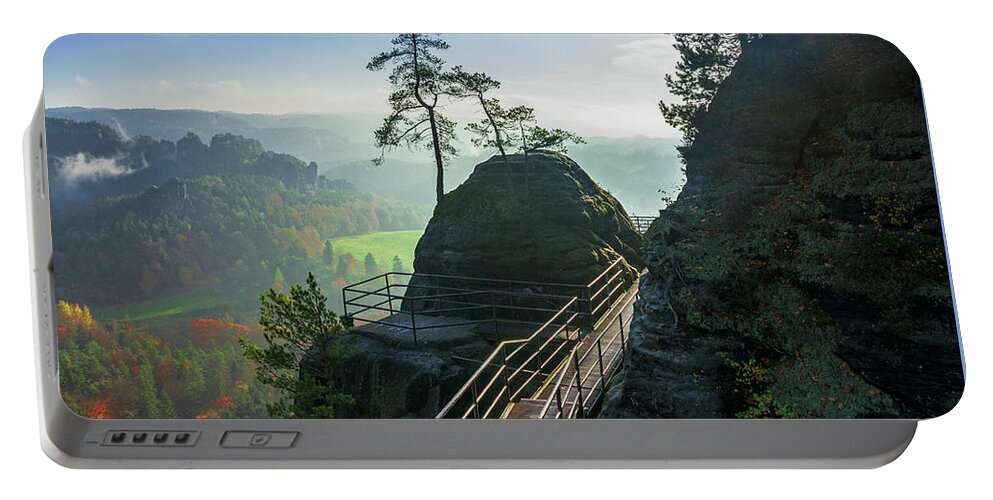 Saxon Switzerland Portable Battery Charger featuring the photograph Misty sunrise on Neurathen Castle by Sun Travels