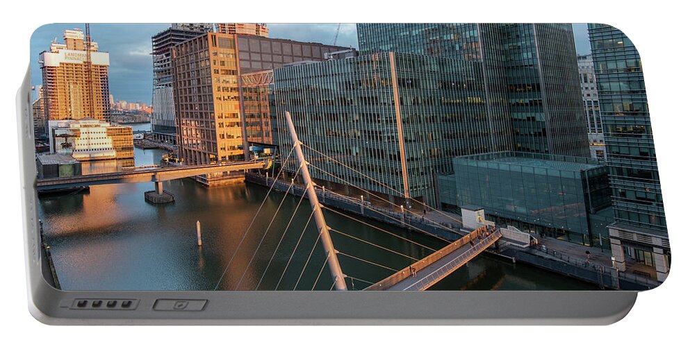 Canary Wharf Portable Battery Charger featuring the photograph Modern office building in the Canary Wharf financial centre in the evening. London united kingdom by Michalakis Ppalis