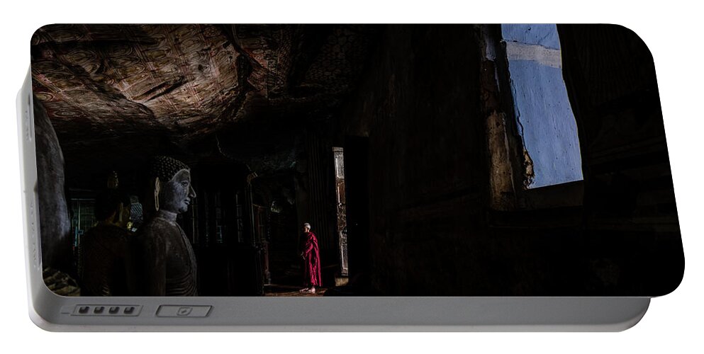 Cave Portable Battery Charger featuring the photograph Monk at Dambulla Cave Temple by Arj Munoz