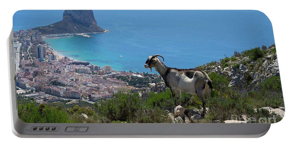 Mountains Portable Battery Charger featuring the photograph Mountain goat looks at Calpe and the Mediterranean Sea by Adriana Mueller