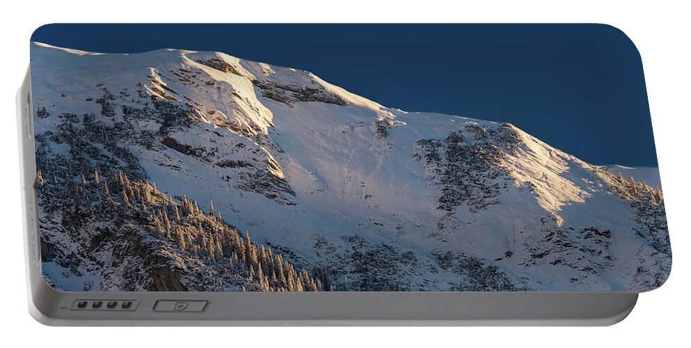 Panorama Portable Battery Charger featuring the photograph Mountain ridge in the early morning winter sun by Stan Weyler