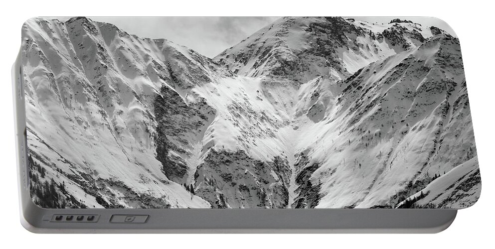 Panorama Portable Battery Charger featuring the photograph Mountain Valley in the Alps covered in fresh Snow by Stan Weyler