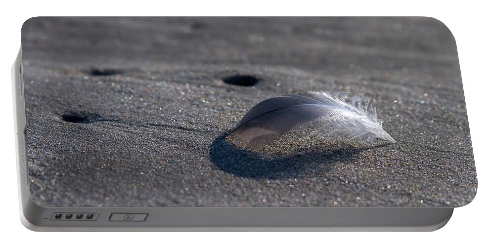 Beach Portable Battery Charger featuring the photograph Mysterious Feather by Liza Eckardt