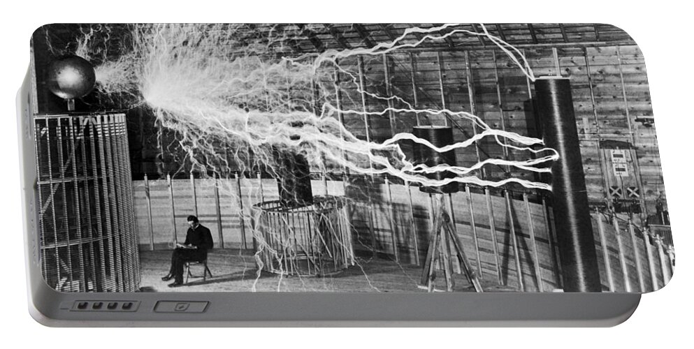 Nikola Tesla Portable Battery Charger featuring the photograph Nikola Tesla - Bolts Of Electricity by War Is Hell Store