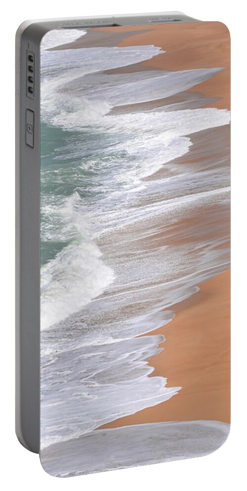 Nazare Portable Battery Charger featuring the photograph North Shore Nazare Beach Portugal by Rebecca Herranen