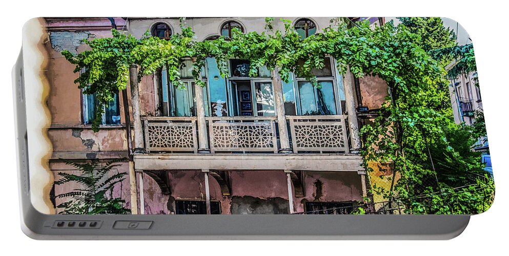 Tiflis Portable Battery Charger featuring the photograph Old ornate grungy house in Tbilisi Georgia covered with grape vines by Susan Vineyard