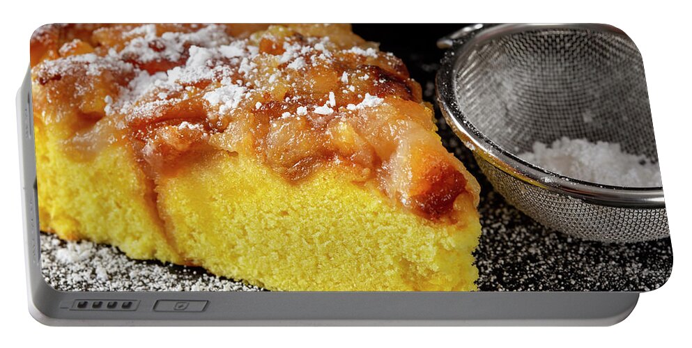 Cake Portable Battery Charger featuring the photograph One slice of an apple cake with powder sugar by Sebastian Radu