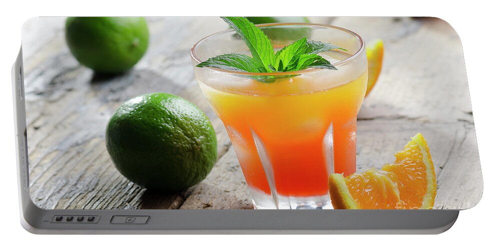 Cocktail Portable Battery Charger featuring the photograph Orange fruit cocktail by Jelena Jovanovic