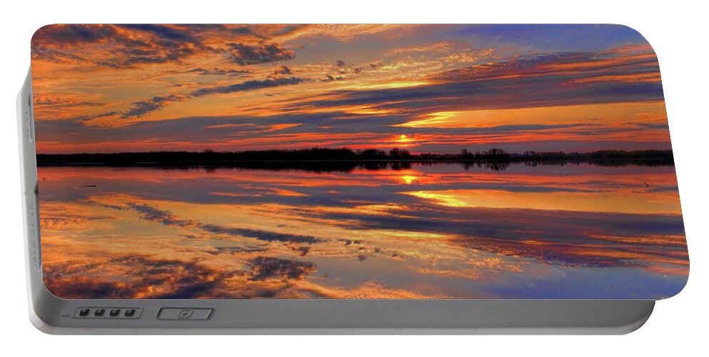 Mead Portable Battery Charger featuring the photograph Orange Sunset Over South Rice Lake by Dale Kauzlaric