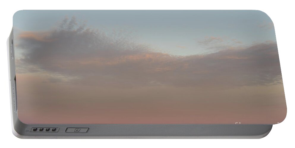 Mediterranean Coast Portable Battery Charger featuring the photograph Pale pink sky and soft clouds at sunset on the Mediterranean coast by Adriana Mueller