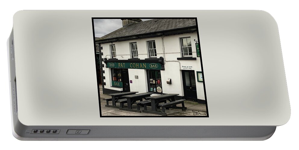 Pub Portable Battery Charger featuring the photograph Pat Cohan's Pub in Tuam, Ireland by Peggy Dietz