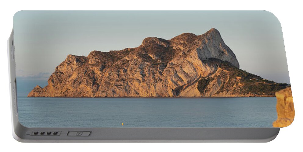 Mediterranean Coast Portable Battery Charger featuring the photograph Penon de Ifach and quarry on the Mediterranean Sea 2 by Adriana Mueller