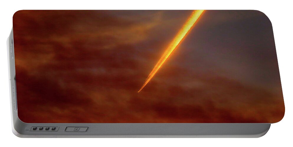 Clouds Portable Battery Charger featuring the photograph Plane Streaking Through Smoky Evening Sky by Linda Stern