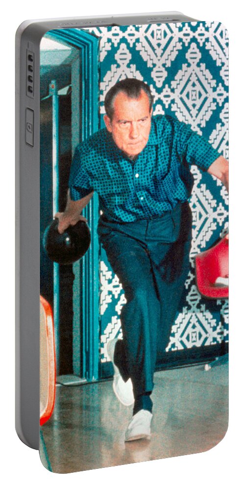 President Nixon Portable Battery Charger featuring the photograph President Richard Nixon Bowling At The White House - Color Version by War Is Hell Store