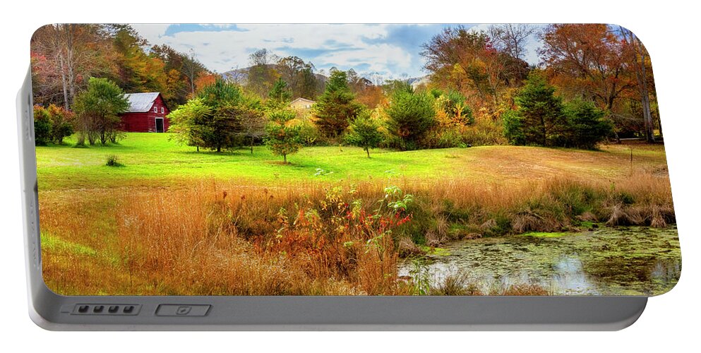 Barns Portable Battery Charger featuring the photograph Red Barn at the Pond by Debra and Dave Vanderlaan
