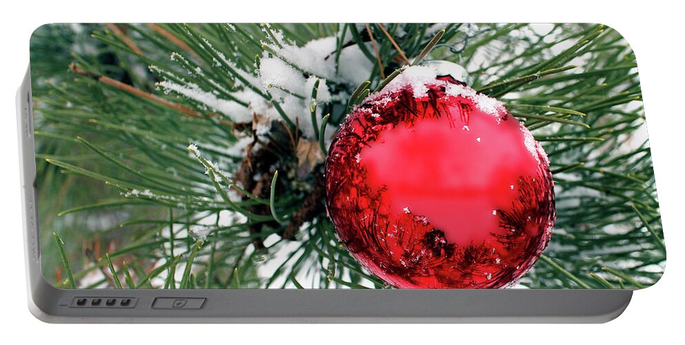 Red Portable Battery Charger featuring the photograph Red Ornament in Evergreen with Snow by Pete Klinger