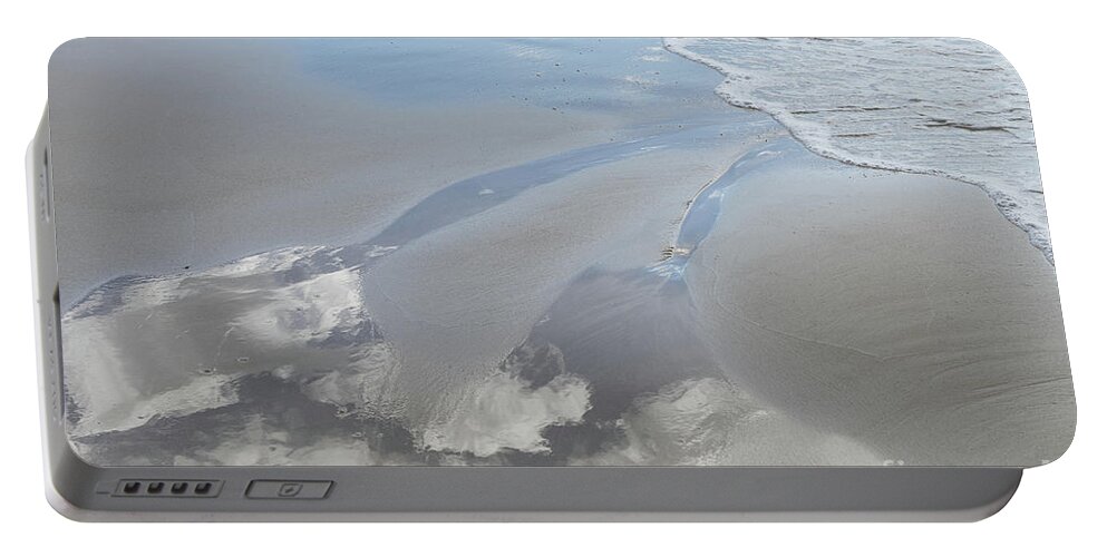 Sandy Beach Portable Battery Charger featuring the photograph Reflection of the clouds in the wet sand by Adriana Mueller