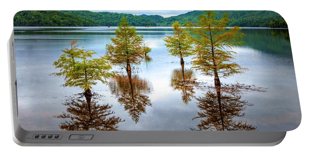 Benton Portable Battery Charger featuring the photograph Reflections of Trees by Debra and Dave Vanderlaan