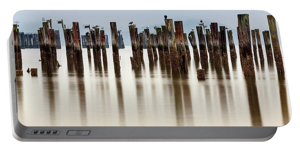 Ocean Portable Battery Charger featuring the photograph Remantents of Old Fish Cannery Dock by Tony Locke