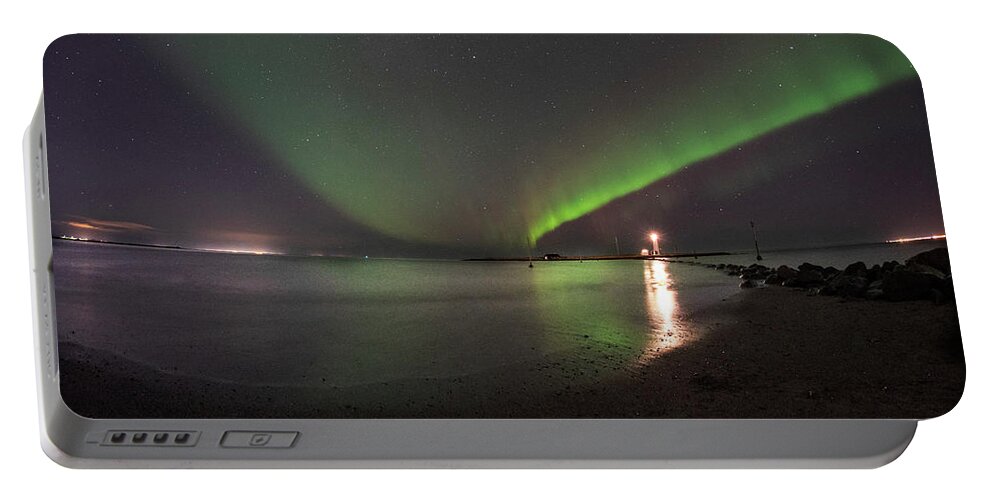Reykjavik Portable Battery Charger featuring the photograph Reykjavik Iceland Beautiful Northern Lights at the Grotta Lighthouse Green Blast by Toby McGuire