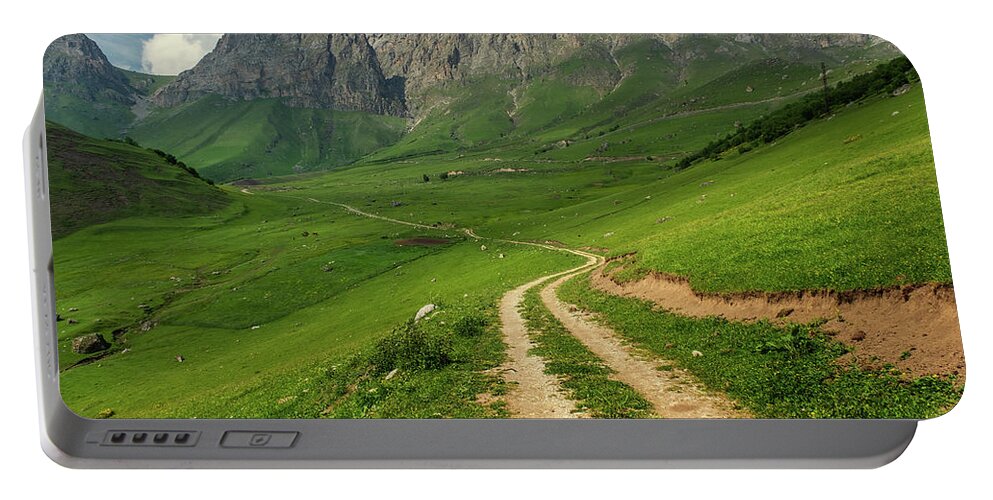 Mountain Portable Battery Charger featuring the photograph Road in mountains by Mikhail Kokhanchikov