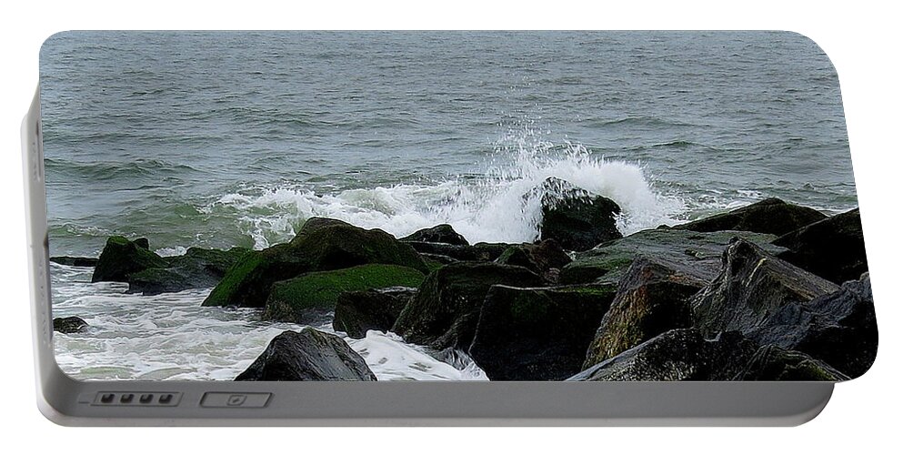 Waves Portable Battery Charger featuring the photograph Rocky Shores of the Atlantic Ocean in Cape May New Jersey by Linda Stern