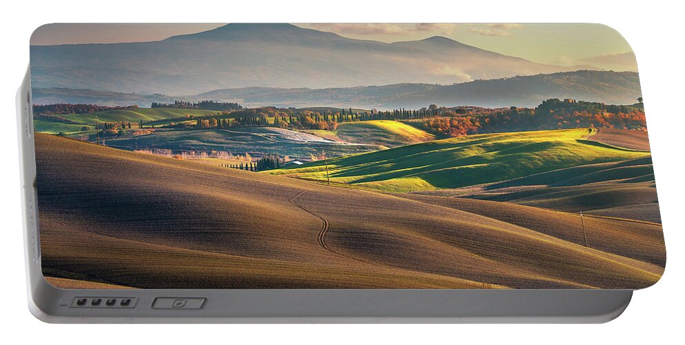 Landscape Portable Battery Charger featuring the photograph Rolling hills and Mount Amiata in Tuscany. by Stefano Orazzini