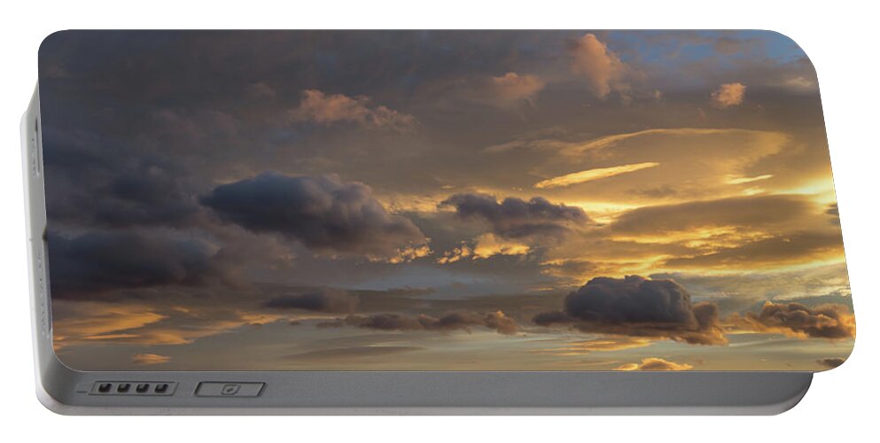 Clouds Portable Battery Charger featuring the photograph Scenic sunset sky in Calpe by Adriana Mueller
