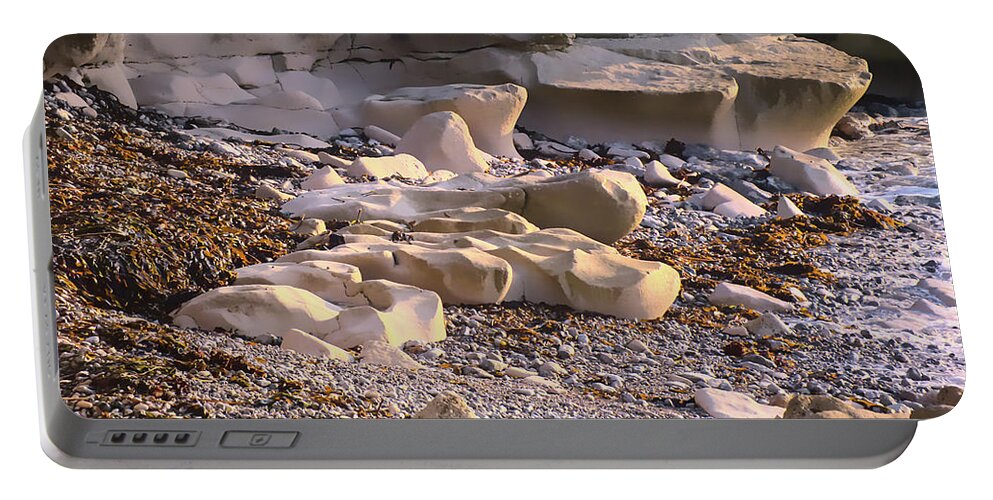 Beach Portable Battery Charger featuring the photograph Sea-worn Portland Rocks by Alan Ackroyd