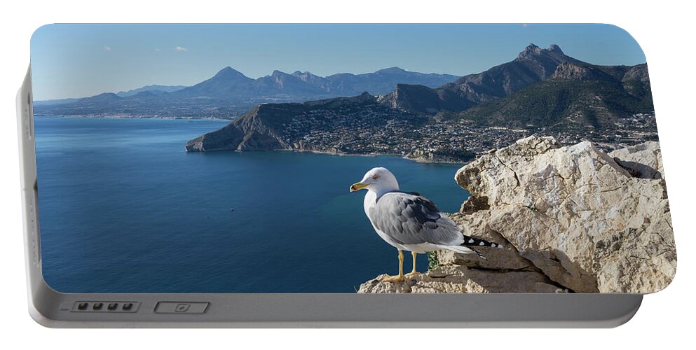 Seagull Portable Battery Charger featuring the photograph Seagull watches the Mediterranean Sea in Spain by Adriana Mueller