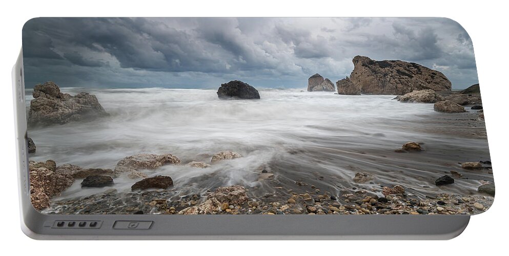 Seascape Portable Battery Charger featuring the photograph Seascape with windy waves during storm weather at the a rocky co by Michalakis Ppalis