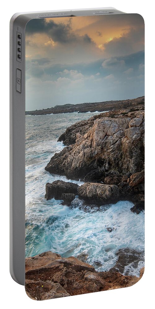Stormy Sea Portable Battery Charger featuring the photograph Seascape with windy waves during stormy weather at sunset. by Michalakis Ppalis