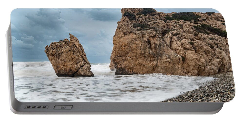 Coastline Portable Battery Charger featuring the photograph Seascapes with windy waves. Rock of Aphrodite Paphos Cyprus by Michalakis Ppalis