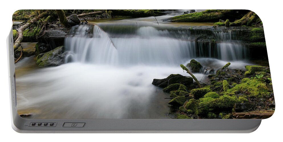 Stream Portable Battery Charger featuring the photograph Serenity in its flow by Jeff Swan